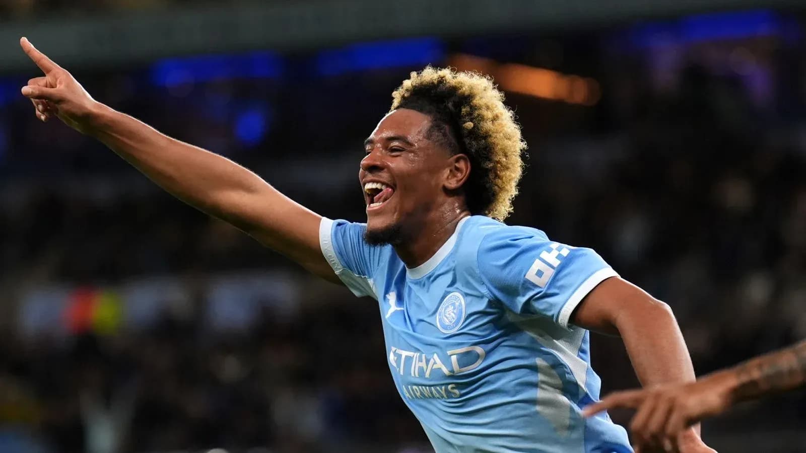 Player celebrating a goal for Manchester City Player celebrating a goal for Manchester City