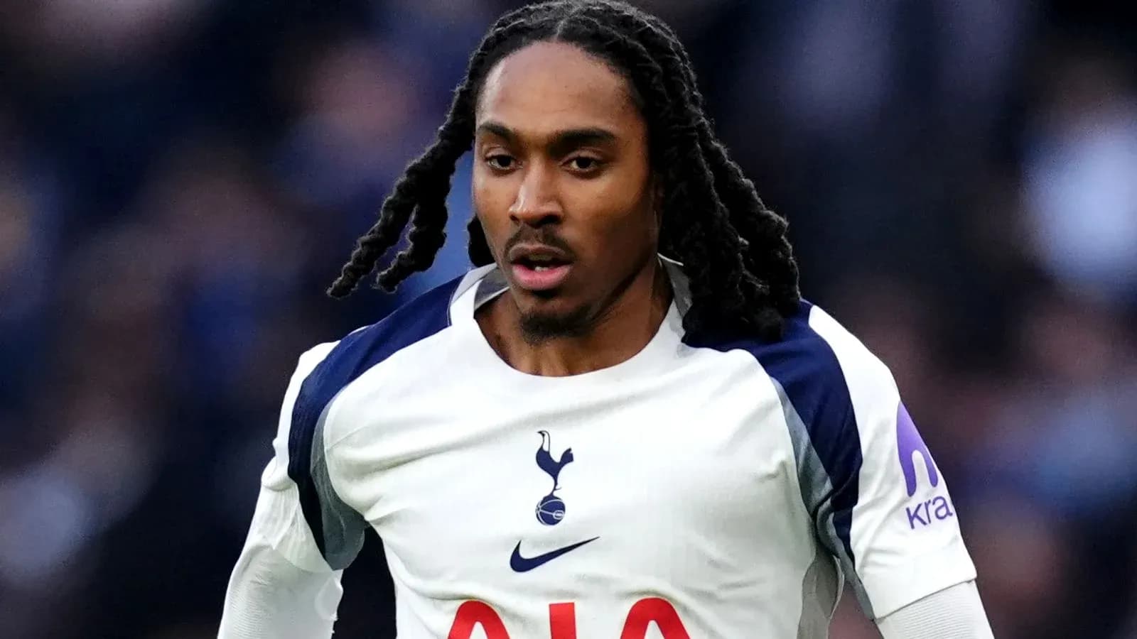 Player running in Tottenham kit during match Player running in Tottenham kit during match