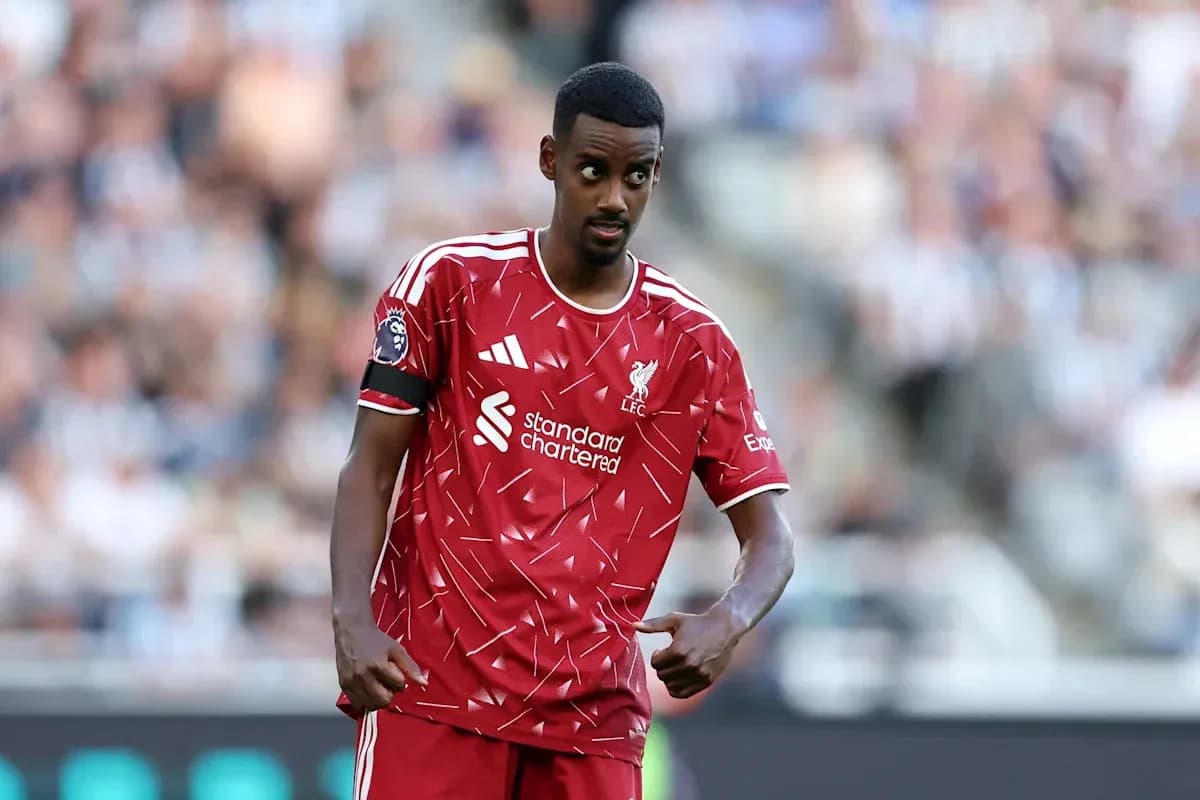 Liverpool player gesturing during match on field Liverpool player gesturing during match on field