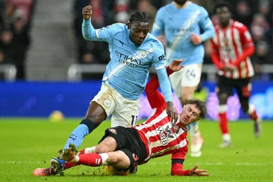 Player tackling opponent during football match action Player tackling opponent during football match action