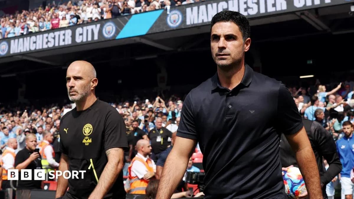 Coaches walking onto the pitch before match Coaches walking onto the pitch before match