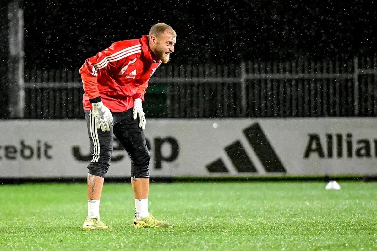 Goalkeeper training in the rain on the pitch Goalkeeper training in the rain on the pitch
