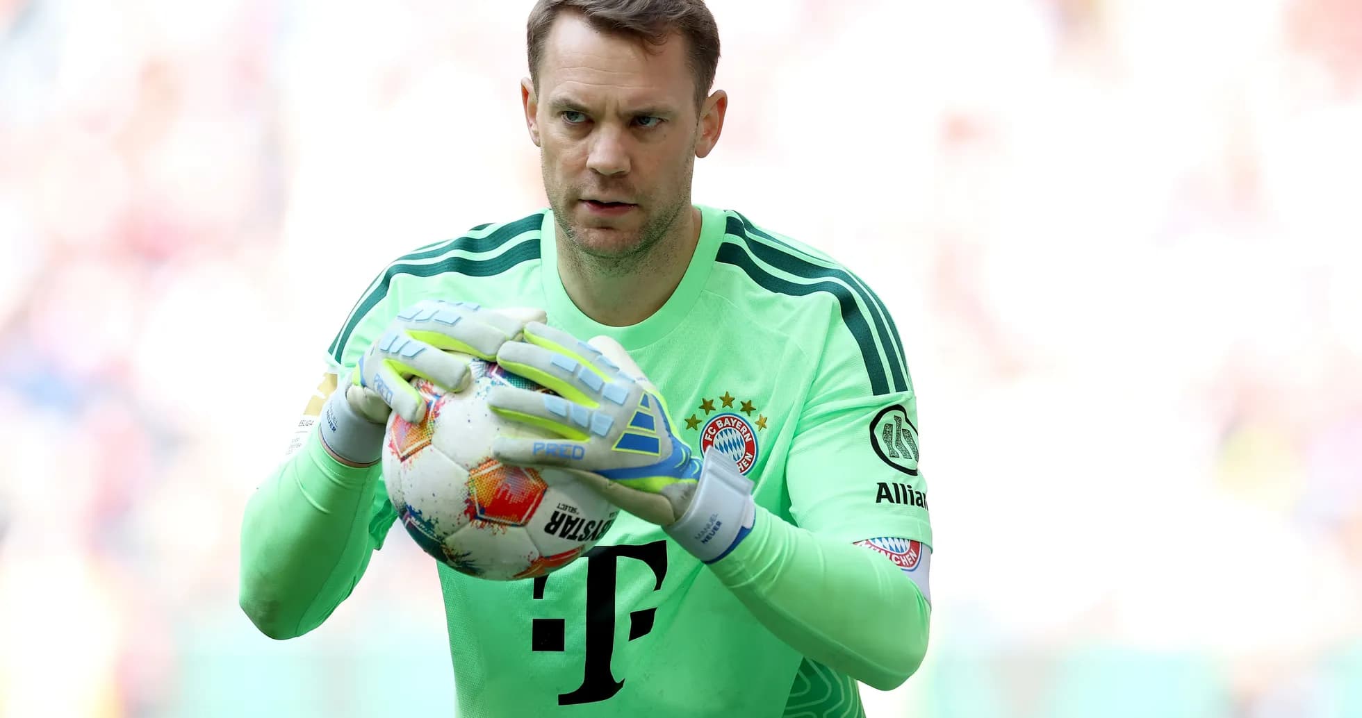 Goalkeeper holding ball during match warm-up Goalkeeper holding ball during match warm-up