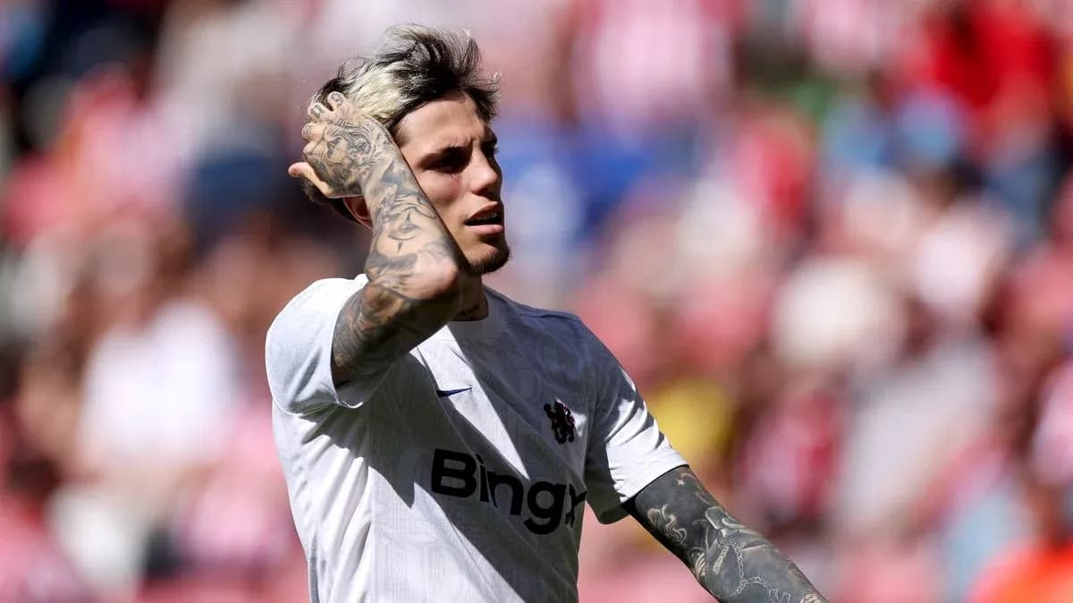Player with tattoos in white jersey on field Player with tattoos in white jersey on field