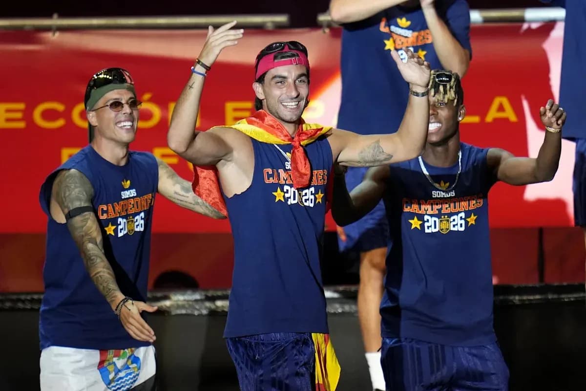 Players celebrating with medals and flags on stage Players celebrating with medals and flags on stage