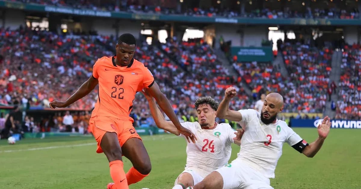 Player 22 of Netherlands dribbling past two defenders Player 22 of Netherlands dribbling past two defenders